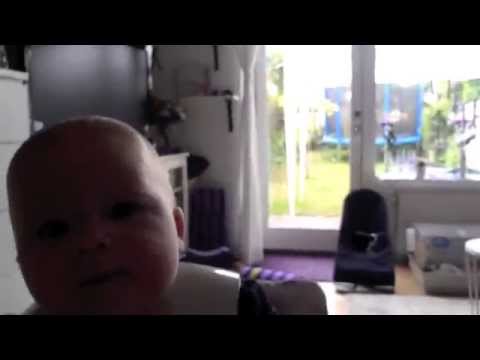 Baby eating babyfood for the first time