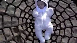 Baby's first time on a swing